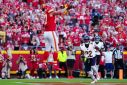 Kansas City tight end Travis Kelce catches a third quarter touchdown in the Chiefs' NFL win over the Chicago Bears, a game attended by pop star Taylor Swift who sat with Kelce's mother