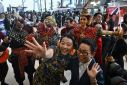 Chinese tourists are greeted by Thai dancers at Suvarnabhumi International Airport in Bangkok