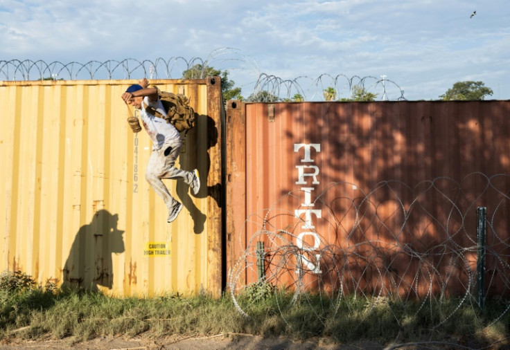 A man from Venezuela, jumps from shipping containers into the United States in Eagle Pass, Texas