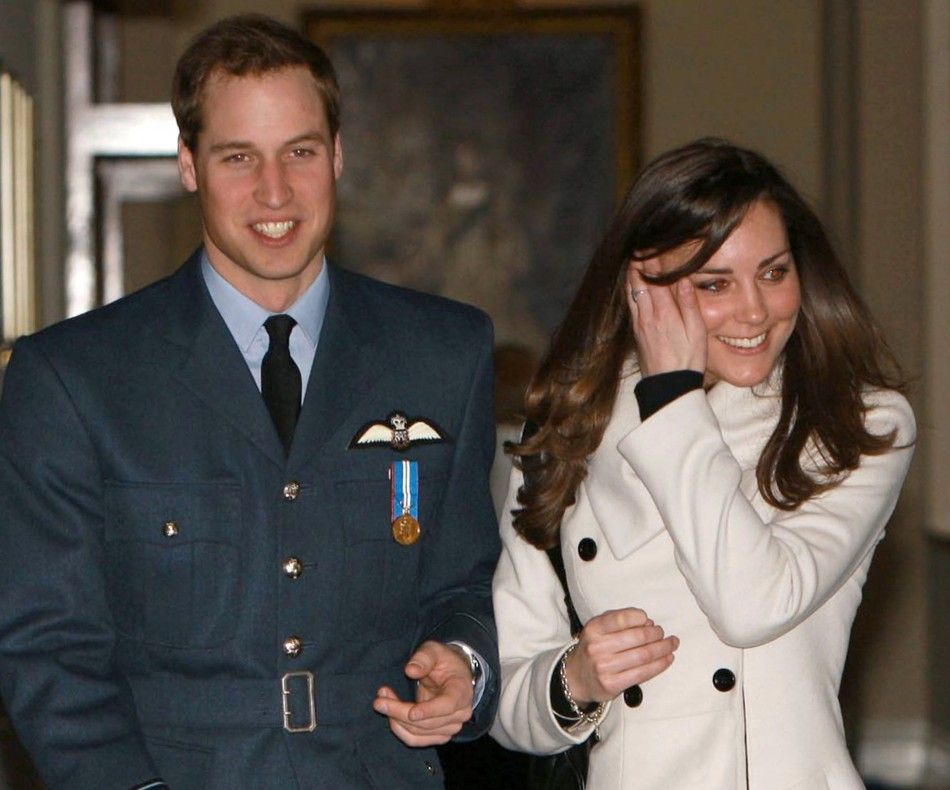File photograph shows Britains Prince William smilling as he walks with his girlfriend Kate Middleton at RAF Cranwell, central England