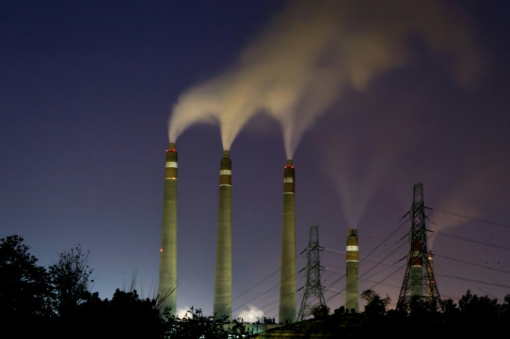 Smoke rises from the chimneys of the Suralaya coal-fired power plant in Cilegon on September 14, 2023Less than a year after it was announced, a USD 20 billion bet to wean Indonesia off coal is mired in controversies over financing and the construction o