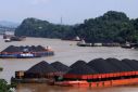 Coal is transported on barges in Samarinda, East Kalimantan, Indonesia on January 11, 2022