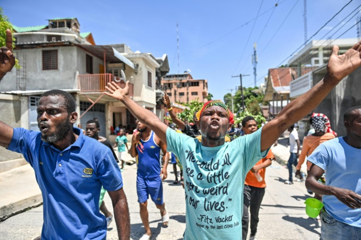 People demonstrate over the rise in the cost of living in the town of Petit-Goave, Haiti