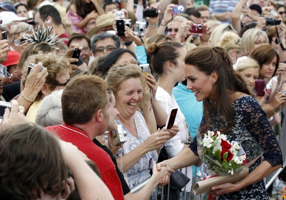 The Duchess of Cambridge Kate Middleton greets admirers following a ceremony at the National War Memorial in Ottawa
