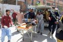 Volunteers stretcher a blast victim into hospital in Quetta