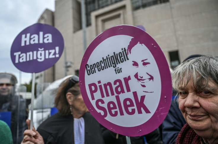 Outside the court, her supporters held placards calling for justice