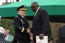 US Defense Secretary Lloyd Austin greets retiring Chairman of the Joint Chiefs of Staff, General Mark Milley