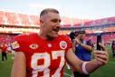 Travis Kelce #87 of the Kansas City Chiefs talks on his phone after a game against the Chicago Bears at GEHA Field at Arrowhead Stadium on September 24, 2023 in Kansas City, Missouri.