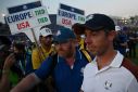 Angry: Rory McIlroy leaves the 18th green