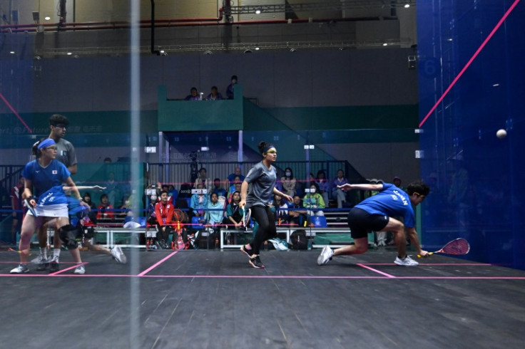 Players from Japan and Pakistan compete at the Asian Games in squash