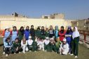 'Don't forget us': In this photograph taken on January 4, 2011, members of Afghanistan's first national women's cricket team pose for a group photo on the sidelines of a training session in Kabul