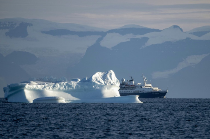 The cruise ship "Ocean Adventurer" sails between icebergs on Greenland's Scoresby Sound