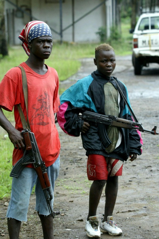 Liberia's civil wars were notorious for the use of child soldiers, as in this 2003 picture from the Buchanan district where youngsters once again fear the outbreak of war