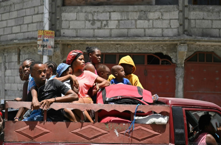 Resident evacuate the Carrefour Feuilles commune in Port-au-Prince, Haiti, earlier this year as gang violence rocks the Caribbean nation's capital