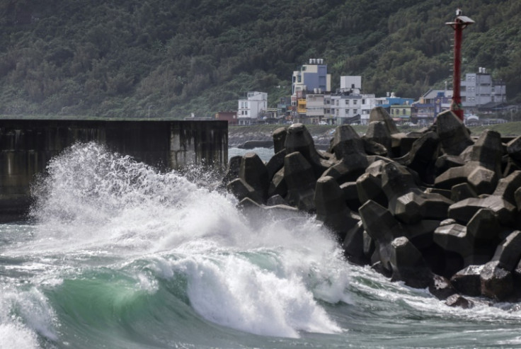 Heavy surf breaks on the shore of northern Taiwan as Typhoon Koinu grazes the island