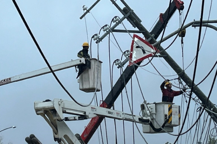 Typhoon Koinu left at least one dead after it grazed Taiwan, lashing the island with the strongest winds it has ever recorded