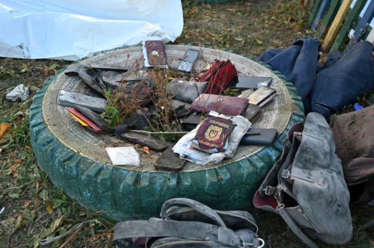 Police collected the personal effects of those killed in the missile strike on Groza