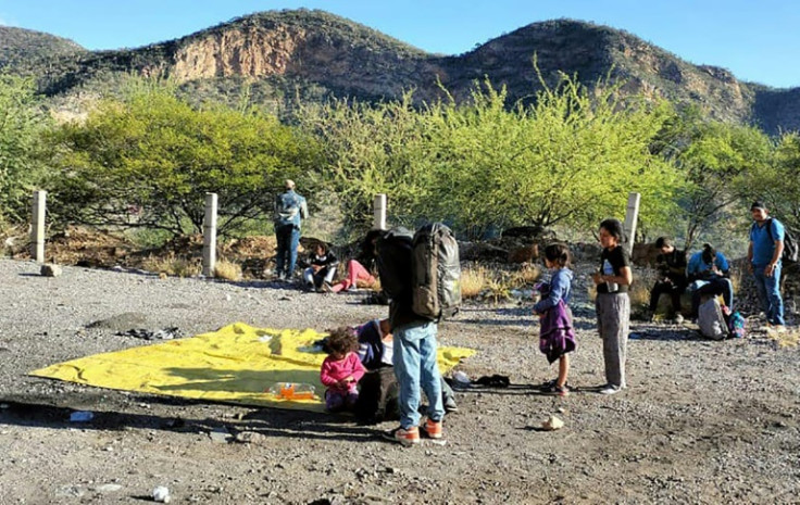 People are seen at the site of a bus crash carrying immigrants in Oaxaca state in a handout picture released by Mexico's Civil Protection