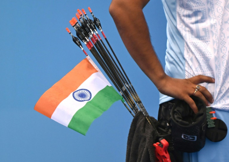 An Indian national flag is seen on an arrow of India's Abhishek Verma