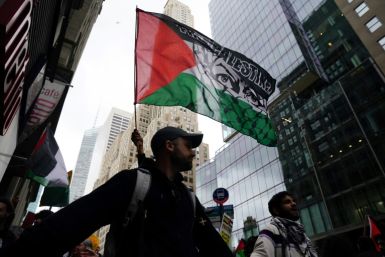 Demonstrators in New York waved Palestinian flags during the peaceful march from Times Square to near both the Israeli consulate and the United Nations headquarters, where the Security Council was to convene over the weekend's violence
