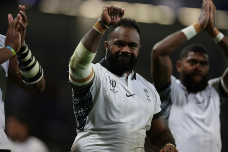 Fiji progress to the World Cup quarter-finals in spite of losing 24-23 to Portugal on Sunday