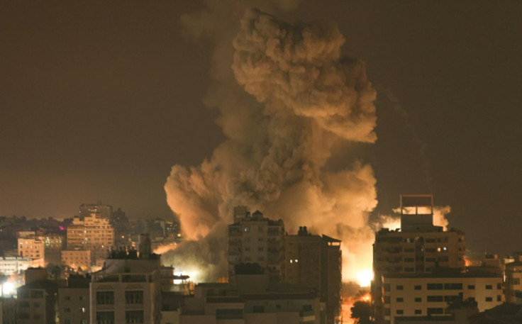 Fire and smoke rise above buildings in Gaza City during an Israeli air strike