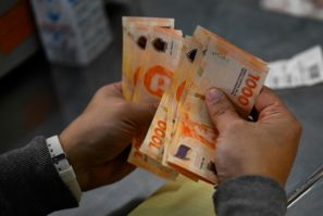 The dollar has long been a safe haven from the peso, with citizens buying the currency whenever they can, as a form of savings and protection from their currency's volatility