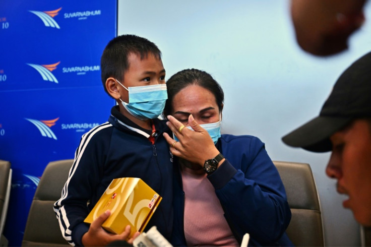 Worried families gathered at Bangkok's Suvarnabhumi International Airport to await the arrival of a commercial flight carrying 15 Thais
