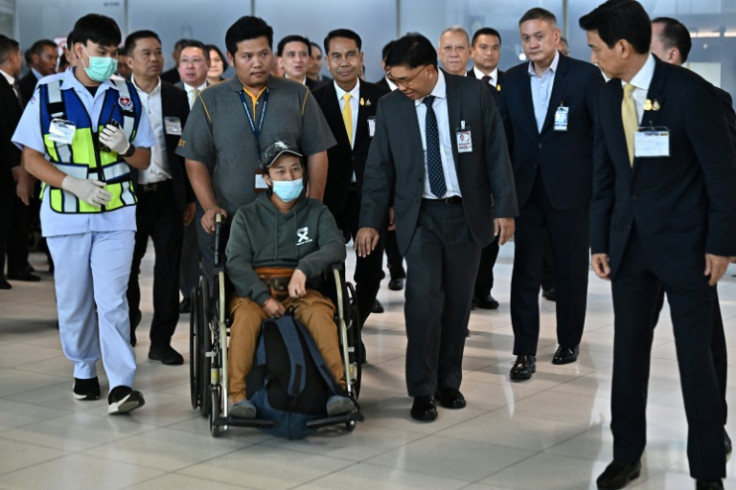 A Thai national injured in a surprise attack on Israel by the Palestinian militant group Hamas returns after an evacuation flight