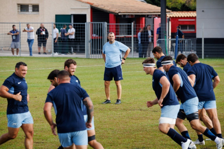Argentina coach Michael Cheika (C) looks at his players during a training session