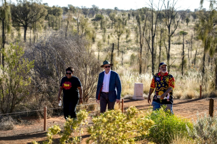 Australian Prime Minister Anthony Albanese (C) walks to a meeting with Indigenous leaders