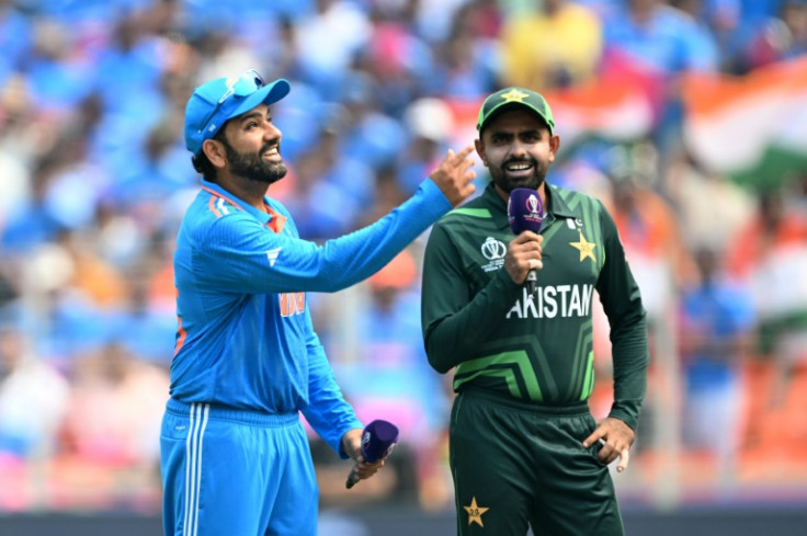 Centre of attention: India captain Rohit Sharma tosses the coin as Pakistan captain Babar Azam watches