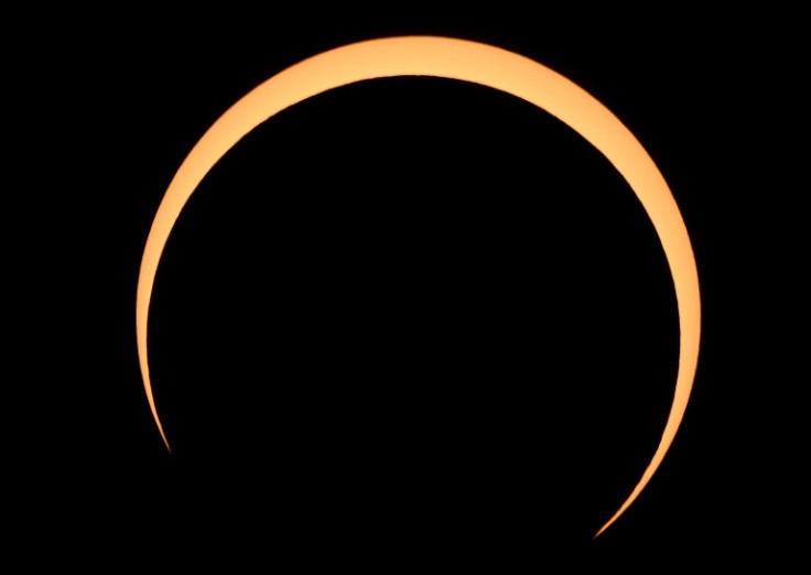 The Moon crosses in front of the Sun over Albuquerque, New Mexico, during an annular eclipse on October 14, 2023