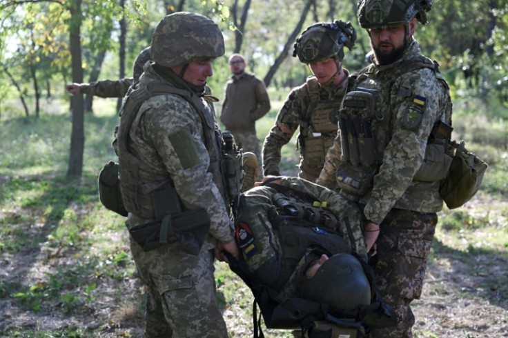 Starting inside, and then moving to work in the undergrowth, the soldiers practiced applying tourniquets