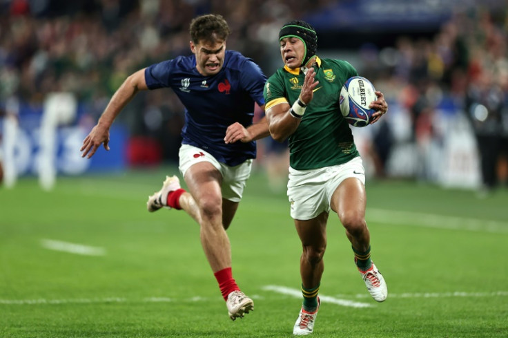 Cheslin Kolbe sprints away from France wing Damian Penaud to score South Africa's third try