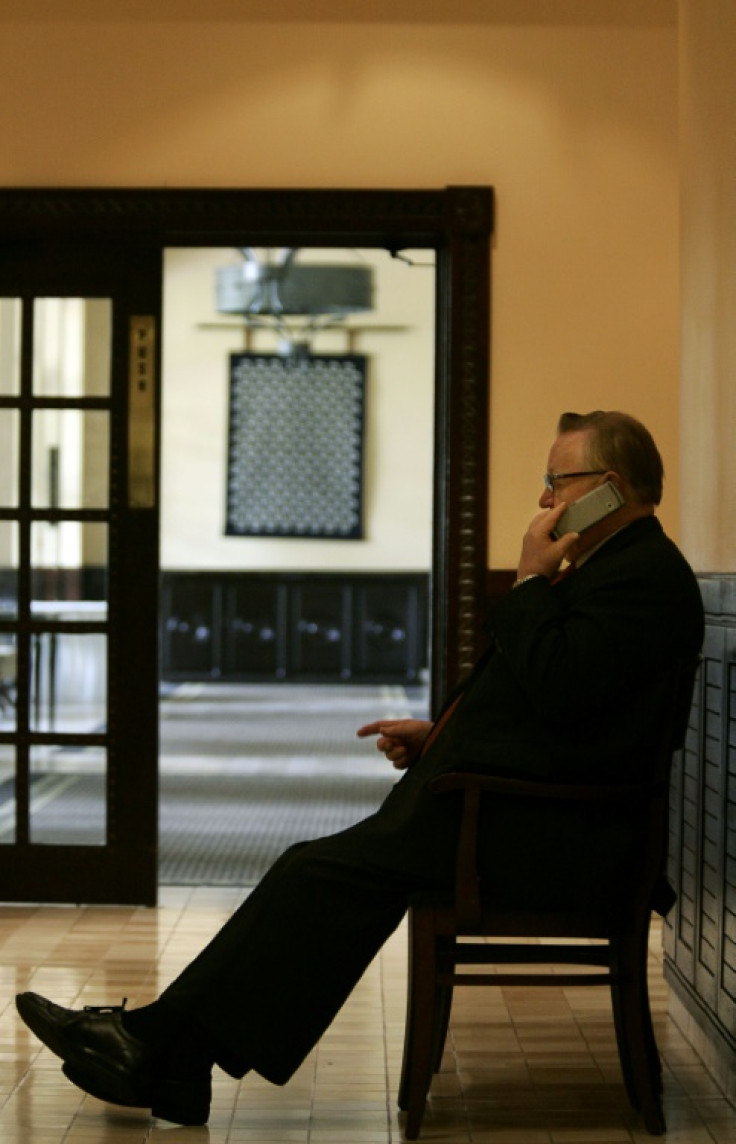Veteran negotiator: Ahtisaari on the phone in a hotel in Dar es Salaam, Tanzania, in 2005