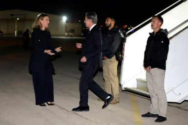 US Ambassador to Jordan Yael Lempert (L) greets US Secretary of State Antony Blinken as he returns to Amman early on October 17, 2023 after marathon talks in Israel