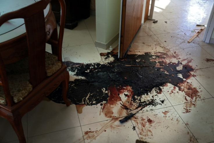 Blood stains cover the floor of a house after the attack by Palestinian Hamas militants on Kibbutz Beeri
