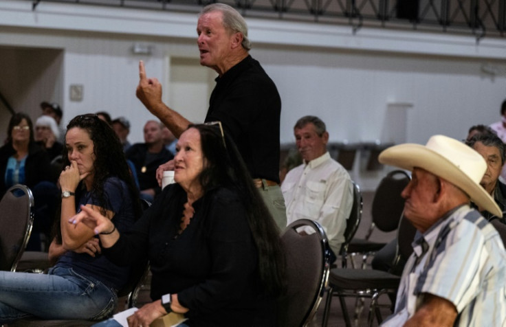 Louisiana resident Larry Louviere (C) confronts local officials about the saltwater intrusion in their drinking water, linked to drought conditions and low river levels