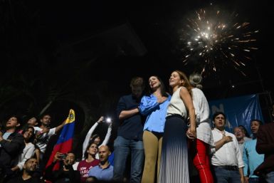 Maria Corina Machado (C) celebrates her victory in an opposition primary in Venezuela on October 22, 2023