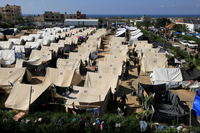 Tents for Palestinians seeking refuge are set up on the grounds of a UN Relief and Works Agency for Palestine Refugees centre in Khan Yunis in the southern Gaza Strip on October 19, 2023