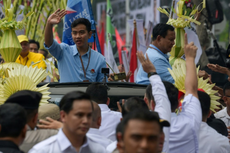 Presidential candidate Prabowo Subianto (R) and his running mate Gibran Rakabuming Raka (L) are considered the frontrunners