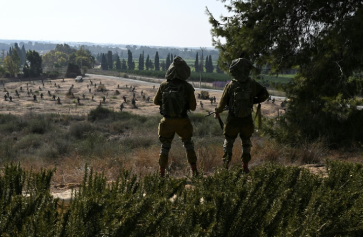 Israeli soldiers in Kibbutz Yad Mordechai, close to Israel's northern border with the Gaza Strip, on October 24, 2023