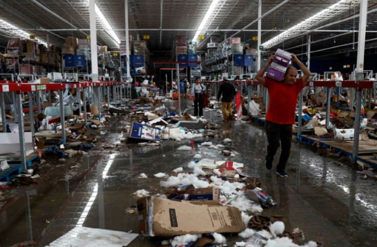 Many supermarket shelves were bare as residents looked for food and water