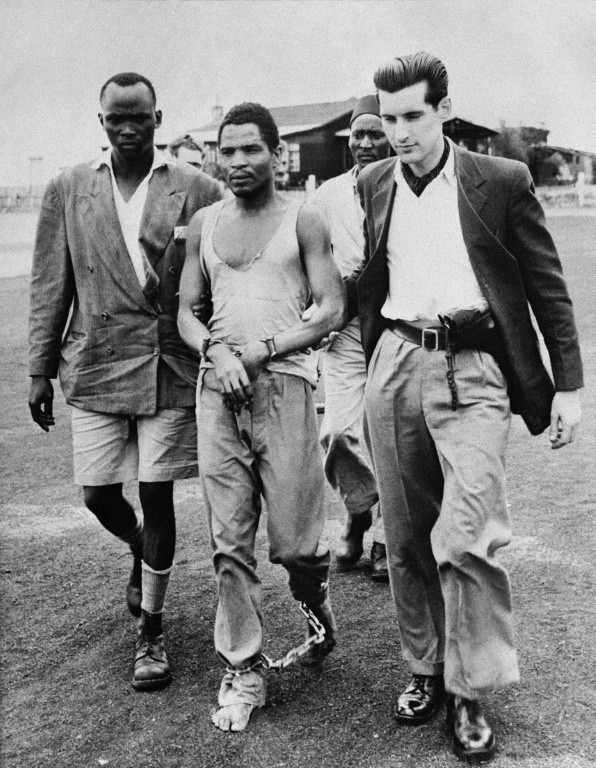 Officials arrest Mau Mau chief Kalebain 1953