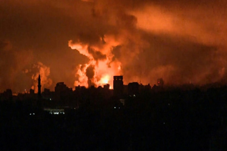 A grab from AFP TV shows fireballs in Gaza City during Israeli strikes