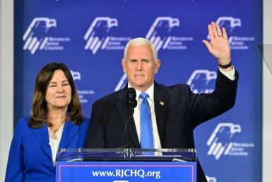 Former US vice president Mike Pence, with his wife Karen, acknowledges the crowd at the Republican Jewish Coalition Annual Leadership Summit after announcing he is dropping out of the 2024 White House race
