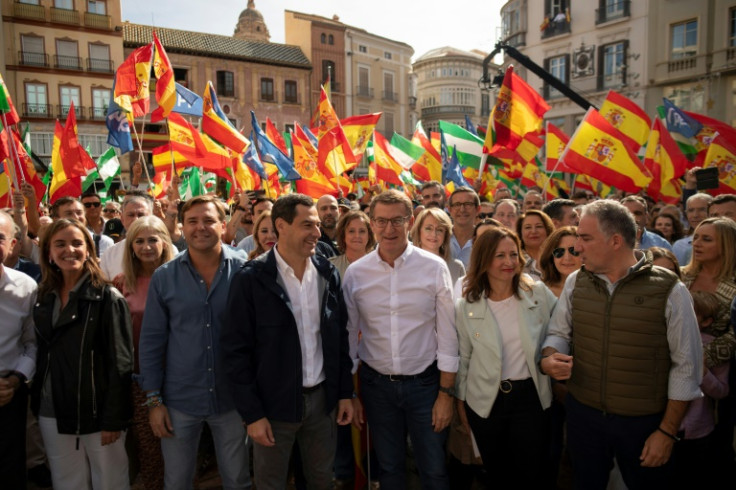 Right-wing Partido Popular leader Alberto Nunez Feijoo (C) at the rally in Malaga