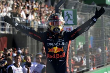 Max Verstappen celebrates after his 16th win of a record-breaking season