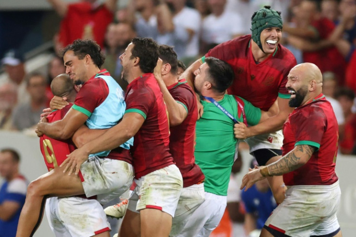 Portugal hooker Mike Tadjer (R) retired on a high as they shocked Fiji in their final pool match